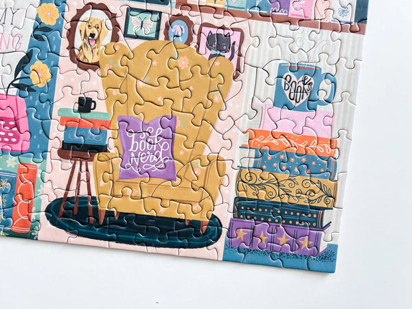 Colorful puzzle with art of a book nook design on a white background