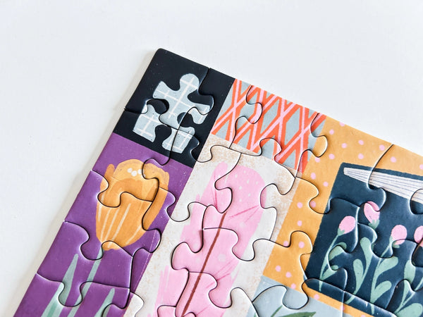 Colorful puzzle section showing floral and abstract designs on a white background