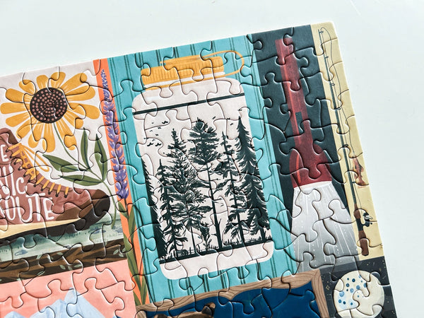 Jigsaw puzzle with partially completed pieces featuring nature-themed artwork on a white background.