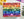 Puzzle box lid with colorful rainbow made of flower illustrations with 'Spaghetti Tree' branding on a white surface.