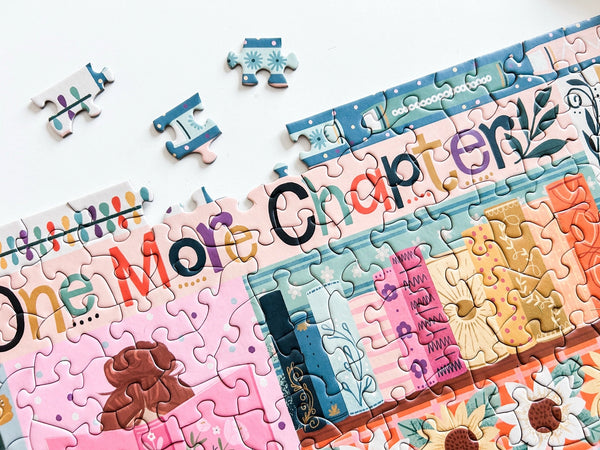 Close up of a section of a colorful book-themed puzzle with text and illustrations on a white background