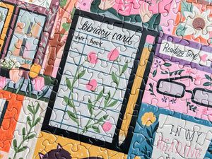 Jigsaw puzzle pieces with book-themed designs including a library card and reading glasses.