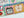 Close up of a colorful puzzle with a soy wax candle and food themed illustrations on a light background