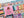 Close up of a portion of a colorful puzzle with 'One More Chapter' text and book-themed design.