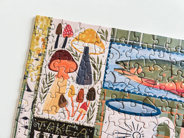 Jigsaw puzzle with a close up of a section showing mushrooms and nature elements on a white background.