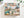 A 1000-piece jigsaw puzzle box by Spaghetti Tree, featuring a colorful collage of rustic outdoor illustrations including a camper, campfire, fish, bear, tent, and nature motifs, displayed on a light surface with soft plant shadows.