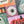 A close up of a halloween themed puzzle showing artwork of an eyeball atop a purple background with orange squiggles. Portions of additional halloween art are also shown.