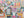 Colorful puzzle with a box and a completed puzzle featuring various book-themed scenes.