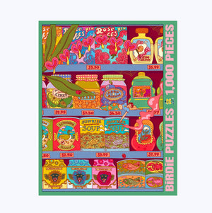 Jigsaw puzzle box against a white surface. Box shows illustration of a psychedelic scene of a tiny human smoking on a store shelf stocked with many jars and cans and boxes.