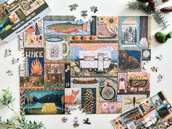 Jigsaw puzzle with camping and nature-themed images on a white surface