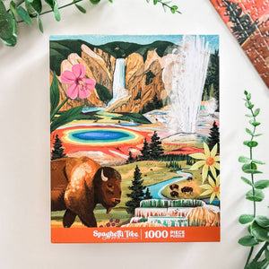 Spaghetti Tree 1000 piece puzzle packaging with a scenic design featuring a bison, flowers, and waterfalls.