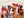 A photo of the puzzle Festive Puppy Pack which shows 9 dogs wearing holiday bows under a garland of golden stars against a light taupe striped background.