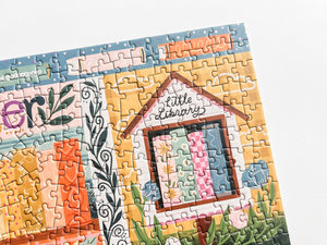 Jigsaw puzzle with a colorful design of a little library on a white background