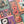 Close up shot of a completed halloween-themed puzzle. Visible art shows a witches hat, pumpkin stack, skull with flowers growing out of it, mummy and ghost with floral design. 