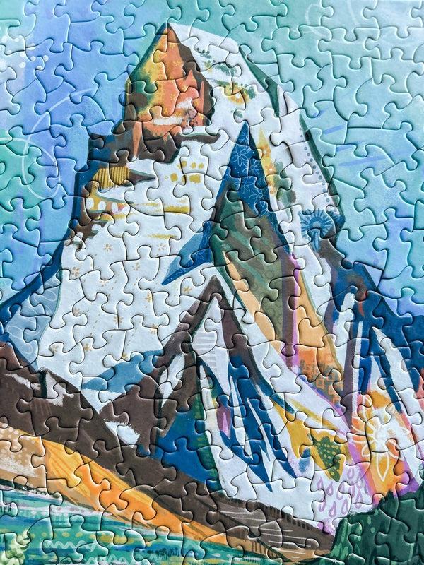Jigsaw puzzle with art of a mountain landscape design. The mountain shown is the Matterhorn.