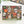 A 500-piece jigsaw puzzle box by Spaghetti Tree Jigsaw Puzzles, featuring a busy Halloween-themed design with sugar skulls, jack-o'-lanterns, candles, and snakes on a black background, displayed on a white surface.