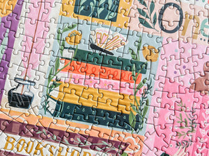 Partial puzzle with colorful design featuring a book stack and plants.