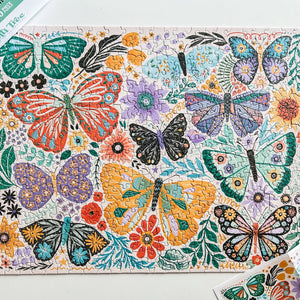 Colorful butterfly and floral pattern on a puzzle with a white background