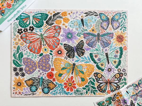 Colorful butterfly and floral pattern on a puzzle with a white background