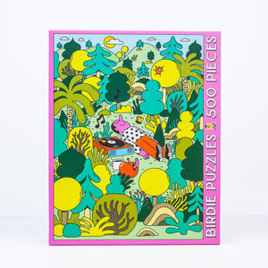 Jigsaw Puzzle box showing illustration of a man lying in the middle of a bunch of trees listening to music on a record player.