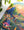 Colorful puzzle with a nature-themed design on a white surface with green leaves.