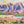 Completed jigsaw puzzle of an illustration of beautiful mountain and valley scene. 