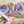 Puzzle box set upon completed version of the puzzle showing illustration of mountain scene.