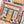 Partial view of a jigsaw puzzle showing an illustration of a bookshop with colorful design.