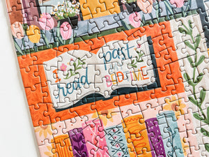 Colorful puzzle with book-themed design on a white background