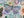 Colorful puzzle close-up with a illustrated butterfly design surrounded by flowers and leaves
