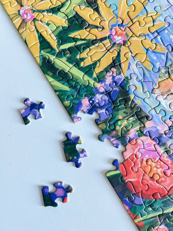 Colorful puzzle with floral design on a light blue background