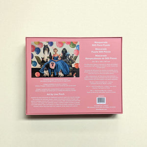 Back of pink puzzle box showing artwork of a woman in blue dress seated next to dogs and cats all wearing fancy masquerade masks.