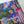Colorful puzzle with a completed section featuring plants and buildings.
