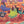Close up detail of completed Girls Night puzzle showing three women, two chatting and one playing with a cat. 
