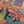 Close up detail of completed Girls Night puzzle showing two womens faces, one is playing with a cat and the other is smiling. 