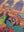 Close up detail of completed Girls Night puzzle showing two womens faces, one is playing with a cat and the other is smiling. 