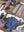 Partial puzzle with colorful design featuring an illustration of a vase of flowers, books, and plants.