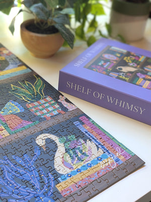 Jigsaw puzzle with close up of corner showing a swan planter illustration on a table next to the packaging titled 'Shelf of Whimsy'.