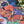 Colorful puzzle illustration of a woman with cats on her head and around her. 
