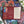 Back of Art & Fable puzzle box showing product details and artist biography. Box is on top of the completed puzzle. 