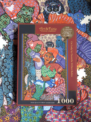 Jigsaw puzzle box with colorful cat-themed artwork and 'Art & Fable' branding