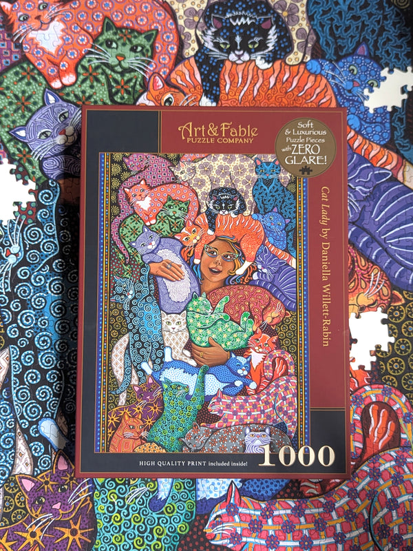 Jigsaw puzzle box with colorful cat-themed artwork and 'Art & Fable' branding