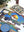 Partially completed puzzle showing an illustration of a domed building with a pool and pigeons, framed by an archway.