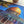 Close up of top-center portion of completed puzzle showing a beautiful golden dome near a potted plant on white.