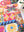 Partial view of a completed jigsaw puzzle with colorful patchwork of patterns, flowers, and butterflies. 