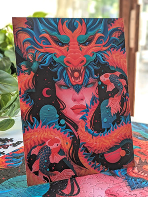 Stand-up art print showing an digital fantasy illustration of a woman's face surrounded by a Red Dragon and two koi fish.