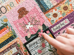 Close-up of a puzzle with a hand placing a piece, featuring a 'Reading Time' theme.