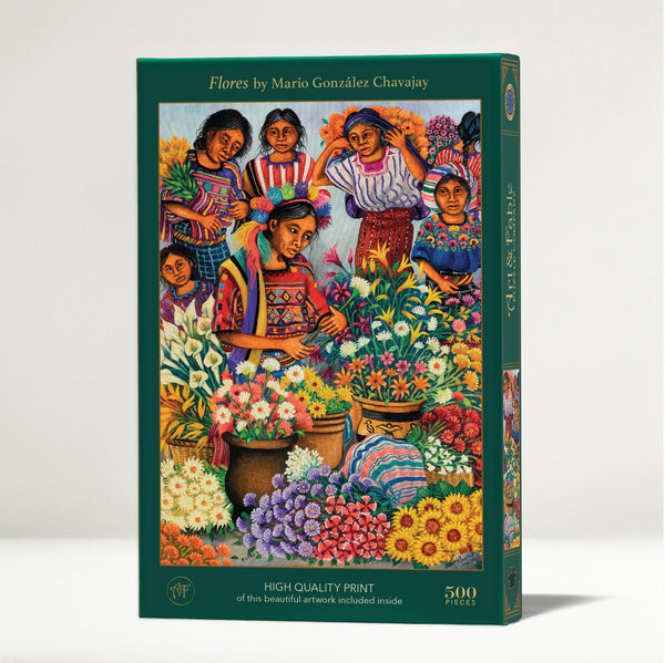 Jigsaw puzzle box featuring colorful artwork of women and flowers, with 'Flores' by Mario González Chavajay on a white background.