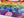Colorful floral puzzle with a rainbow gradient on a white surface