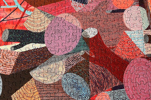 Close up of puzzle details showing colorful abstract artwork of logs created with circular patterns and vibrant colors